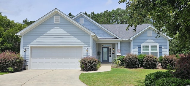 309 Outboard Dr, Murrells Inlet, SC 29576 - view of front of property featuring driveway, a garage, a front yard, and roof with shingles