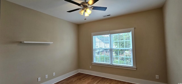 309 Outboard Dr, Murrells Inlet, SC 29576 - spare room with healthy amount of natural light, dark wood finished floors, and ceiling fan