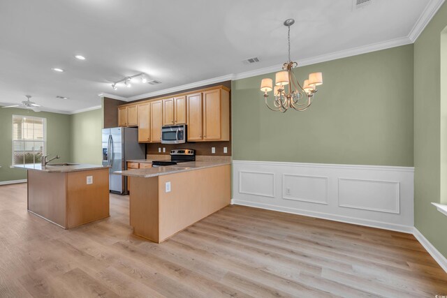 945 Rosencrans Ln Unit B, Myrtle Beach, SC 29577 - kitchen featuring appliances with stainless steel finishes, ornamental molding, a chandelier, light wood finished floors, and wainscoting