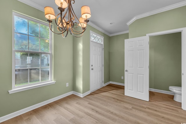 945 Rosencrans Ln Unit B, Myrtle Beach, SC 29577 - unfurnished dining area featuring a chandelier, ornamental molding, and light wood finished floors