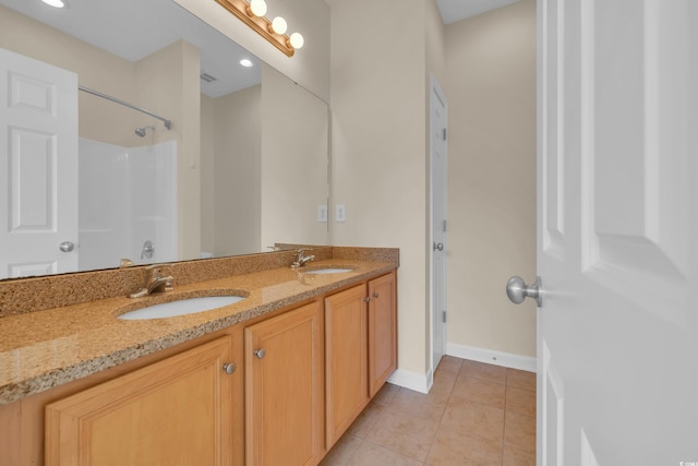 945 Rosencrans Ln Unit B, Myrtle Beach, SC 29577 - bathroom featuring double vanity, tile patterned flooring, and a shower