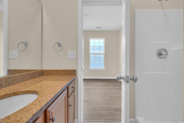 945 Rosencrans Ln Unit B, Myrtle Beach, SC 29577 - full bath featuring vanity, wood finished floors, and a shower