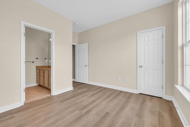 945 Rosencrans Ln Unit B, Myrtle Beach, SC 29577 - unfurnished bedroom with light wood finished floors and ensuite bathroom