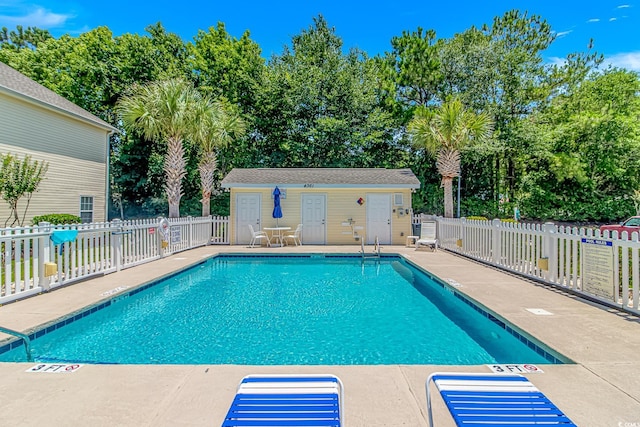 4366 Rivergate Ln Unit 306, Little River, SC 29566 - community pool with a patio and view of scattered trees