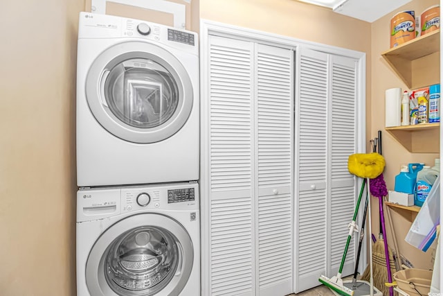 4366 Rivergate Ln Unit 306, Little River, SC 29566 - laundry room featuring stacked washer / dryer