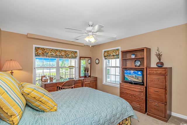 4366 Rivergate Ln Unit 306, Little River, SC 29566 - bedroom featuring multiple windows, light carpet, and ceiling fan
