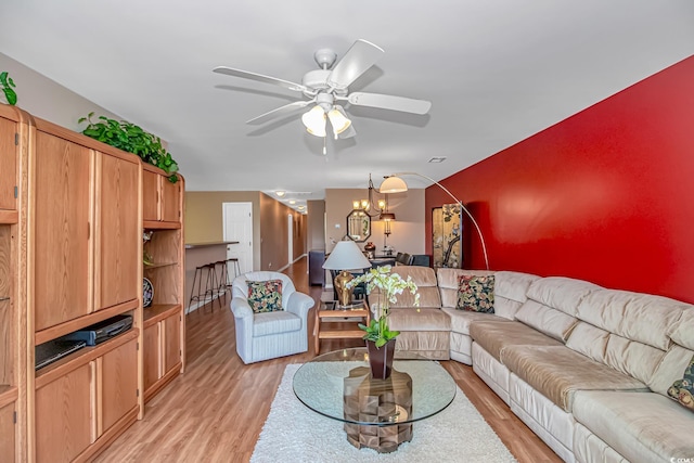 4366 Rivergate Ln Unit 306, Little River, SC 29566 - living area featuring a ceiling fan, light wood finished floors, and a chandelier