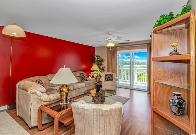 4366 Rivergate Ln Unit 306, Little River, SC 29566 - living area with wood finished floors and a ceiling fan