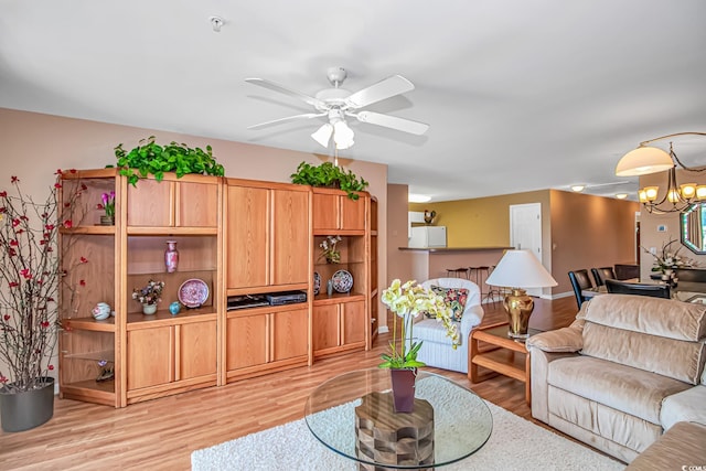 4366 Rivergate Ln Unit 306, Little River, SC 29566 - living room with a ceiling fan, light wood-style floors, and a chandelier