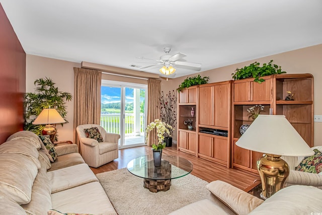 4366 Rivergate Ln Unit 306, Little River, SC 29566 - living room with a ceiling fan and light wood-style flooring