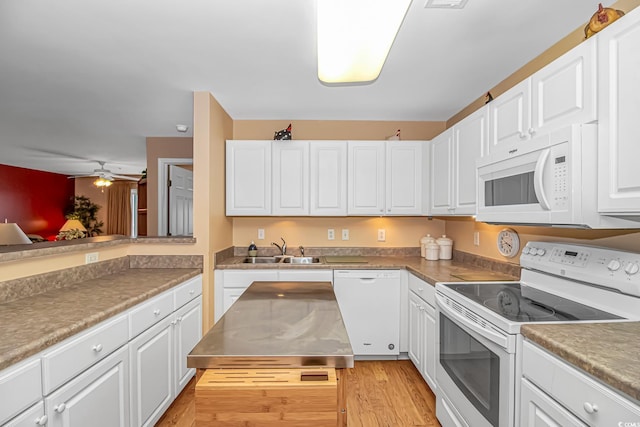 4366 Rivergate Ln Unit 306, Little River, SC 29566 - kitchen featuring white appliances, white cabinetry, light wood-style floors, and ceiling fan