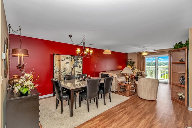 4366 Rivergate Ln Unit 306, Little River, SC 29566 - dining room with light wood-style flooring, a chandelier, and a ceiling fan
