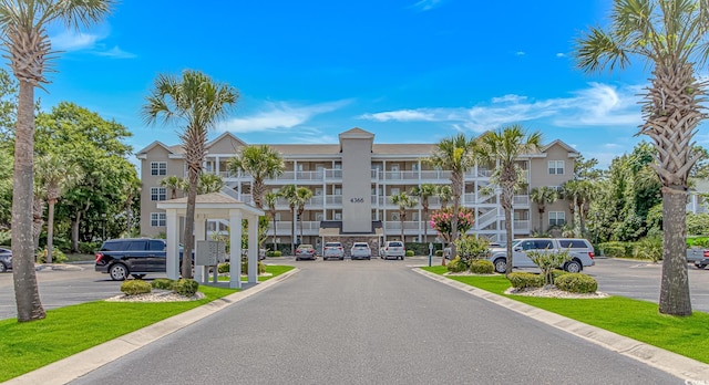4366 Rivergate Ln Unit 306, Little River, SC 29566 - view of apartment building / complex featuring uncovered parking