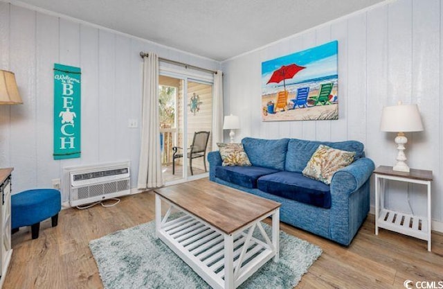 4201 N Ocean Blvd Unit 2M, North Myrtle Beach, SC 29582 - living area with wood finished floors, a wall mounted AC, and wooden walls