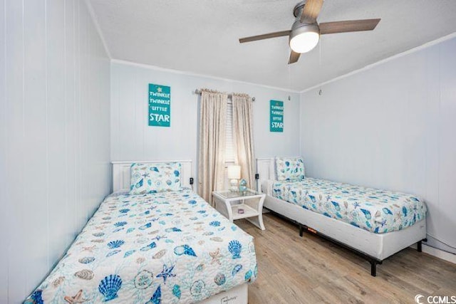 4201 N Ocean Blvd Unit 2M, North Myrtle Beach, SC 29582 - bedroom with wood finished floors, ornamental molding, and ceiling fan