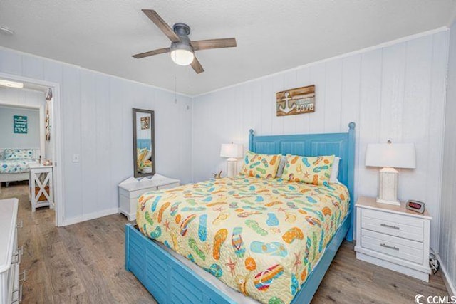 4201 N Ocean Blvd Unit 2M, North Myrtle Beach, SC 29582 - bedroom featuring wood finished floors, ceiling fan, and a textured ceiling
