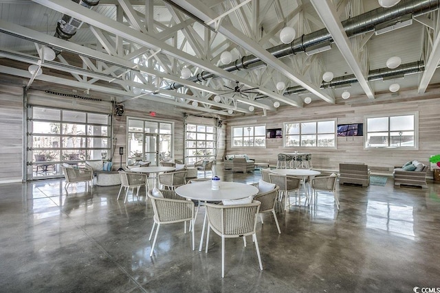 153 Goldenrod Cir Unit 7D, Little River, SC 29566 - dining area featuring finished concrete flooring and high vaulted ceiling