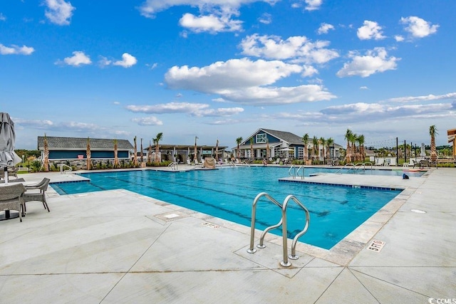 153 Goldenrod Cir Unit 7D, Little River, SC 29566 - community pool featuring a patio area