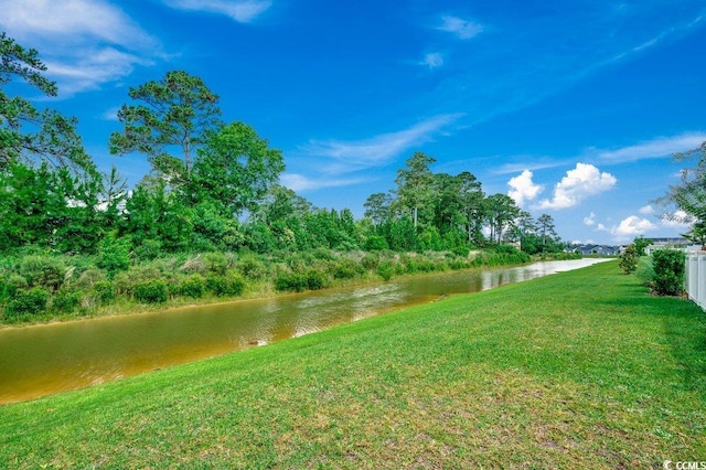 153 Goldenrod Cir Unit 7D, Little River, SC 29566 - view of grassy yard featuring a water view