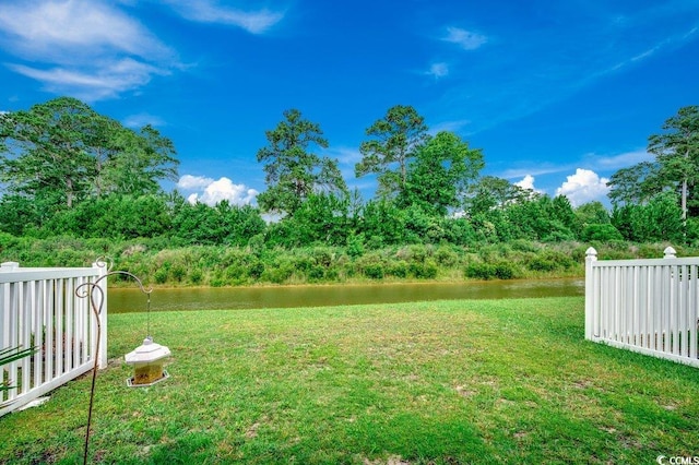 153 Goldenrod Cir Unit 7D, Little River, SC 29566 - view of grassy yard featuring a water view