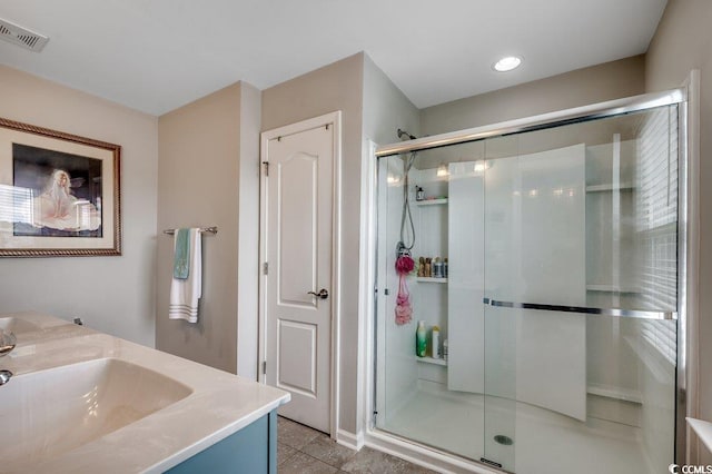 153 Goldenrod Cir Unit 7D, Little River, SC 29566 - bathroom with a stall shower, vanity, and tile patterned flooring