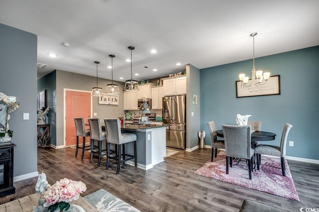 153 Goldenrod Cir Unit 7D, Little River, SC 29566 - dining area featuring recessed lighting, a chandelier, and dark wood-style floors
