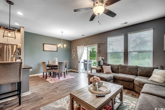 153 Goldenrod Cir Unit 7D, Little River, SC 29566 - living room with a chandelier, a ceiling fan, light wood-type flooring, and recessed lighting