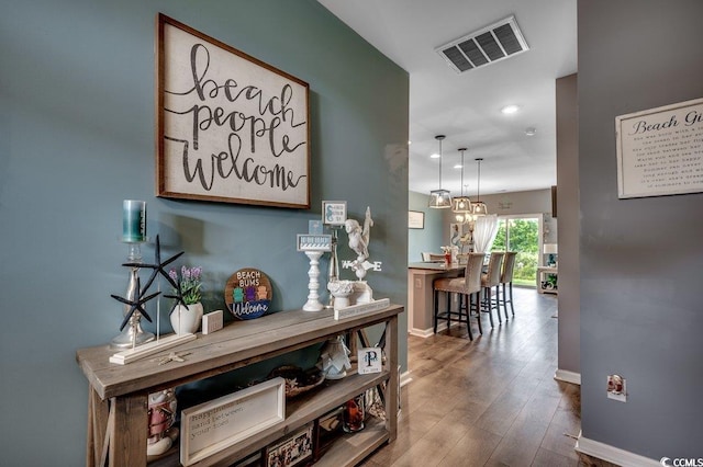 153 Goldenrod Cir Unit 7D, Little River, SC 29566 - hall with recessed lighting, wood finished floors, and a chandelier