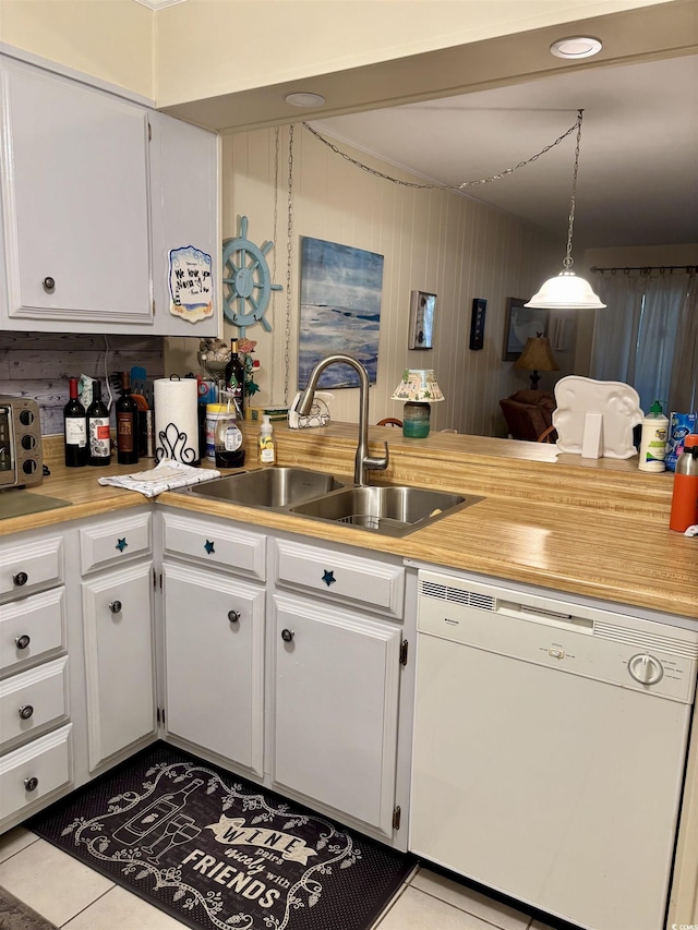 9501 Shore Dr Unit 323, Myrtle Beach, SC 29572 - kitchen featuring white dishwasher, light countertops, white cabinetry, and tile patterned flooring