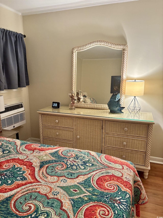 9501 Shore Dr Unit 323, Myrtle Beach, SC 29572 - bedroom featuring crown molding, wood finished floors, and a wall mounted air conditioner