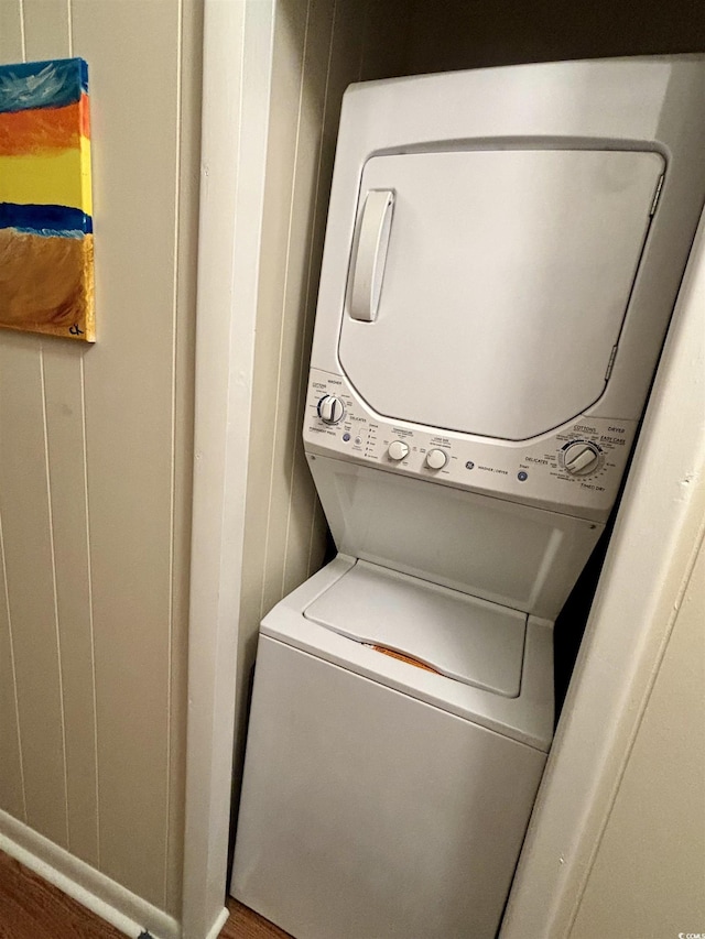 9501 Shore Dr Unit 323, Myrtle Beach, SC 29572 - laundry room with stacked washer / drying machine and wood finished floors