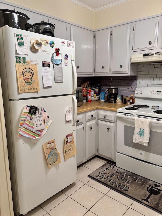 9501 Shore Dr Unit 323, Myrtle Beach, SC 29572 - kitchen with white appliances, crown molding, light tile patterned floors, under cabinet range hood, and light countertops