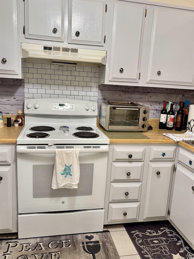 9501 Shore Dr Unit 323, Myrtle Beach, SC 29572 - kitchen featuring electric range, under cabinet range hood, light countertops, and white cabinets