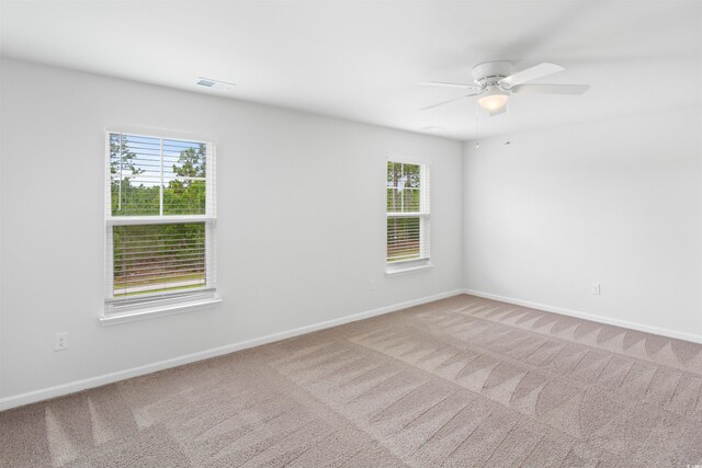 3657 Bells Lake Cir, Longs, SC 29568 - unfurnished room featuring healthy amount of natural light, carpet flooring, and a ceiling fan