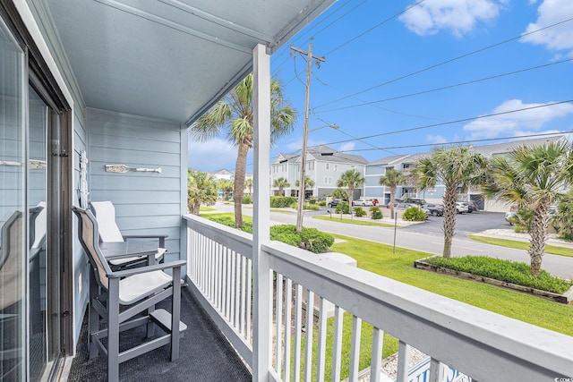 1210 N Ocean Blvd Unit 104, Surfside Beach, SC 29575 - covered porch featuring a residential view