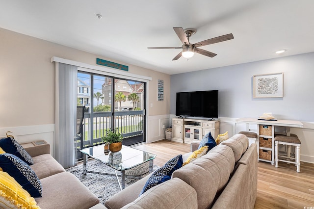 1210 N Ocean Blvd Unit 104, Surfside Beach, SC 29575 - living room with a ceiling fan, wainscoting, and light wood finished floors