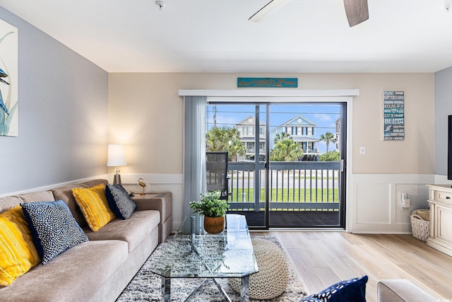 1210 N Ocean Blvd Unit 104, Surfside Beach, SC 29575 - living room with a wainscoted wall, wood finished floors, and a ceiling fan