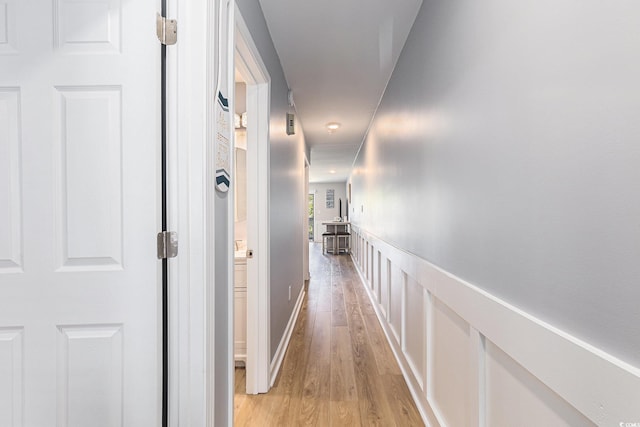 1210 N Ocean Blvd Unit 104, Surfside Beach, SC 29575 - hall featuring light wood-style flooring and a wainscoted wall