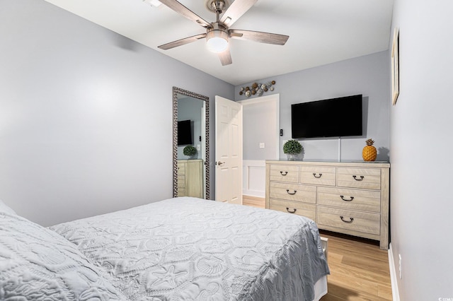 1210 N Ocean Blvd Unit 104, Surfside Beach, SC 29575 - bedroom featuring light wood finished floors and a ceiling fan