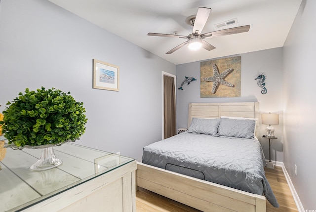 1210 N Ocean Blvd Unit 104, Surfside Beach, SC 29575 - bedroom with light wood-type flooring and a ceiling fan