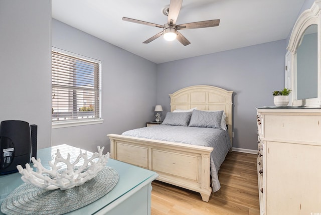 1210 N Ocean Blvd Unit 104, Surfside Beach, SC 29575 - bedroom featuring light wood finished floors and a ceiling fan