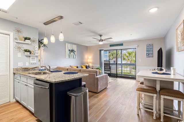 1210 N Ocean Blvd Unit 104, Surfside Beach, SC 29575 - kitchen featuring stainless steel dishwasher, a peninsula, light wood finished floors, open floor plan, and recessed lighting
