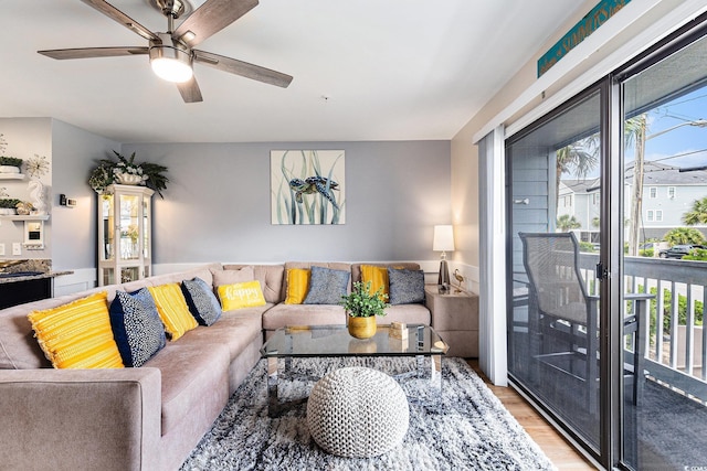 1210 N Ocean Blvd Unit 104, Surfside Beach, SC 29575 - living area featuring light wood-style flooring and ceiling fan