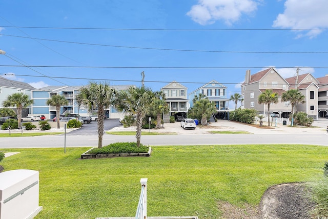 1210 N Ocean Blvd Unit 104, Surfside Beach, SC 29575 - view of green lawn featuring a residential view