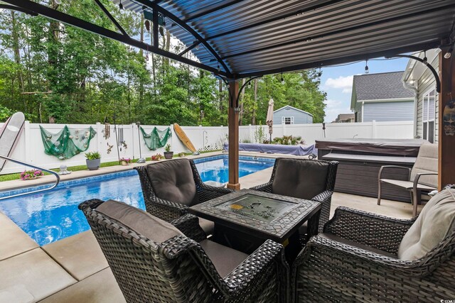 144 Baylee Cir, Aynor, SC 29544 - fenced backyard featuring a covered hot tub, a patio, and a fire pit
