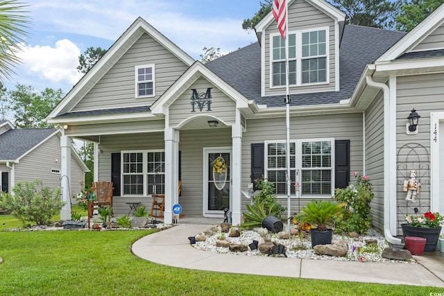 144 Baylee Cir, Aynor, SC 29544 - view of front of property featuring roof with shingles, a front lawn, and covered porch