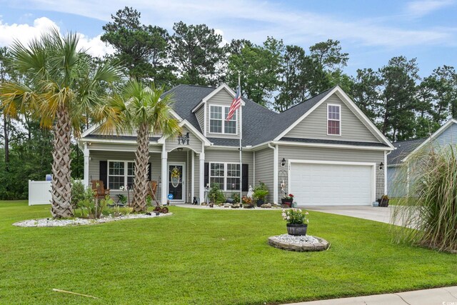 144 Baylee Cir, Aynor, SC 29544 - traditional-style house with a front lawn, driveway, and roof with shingles