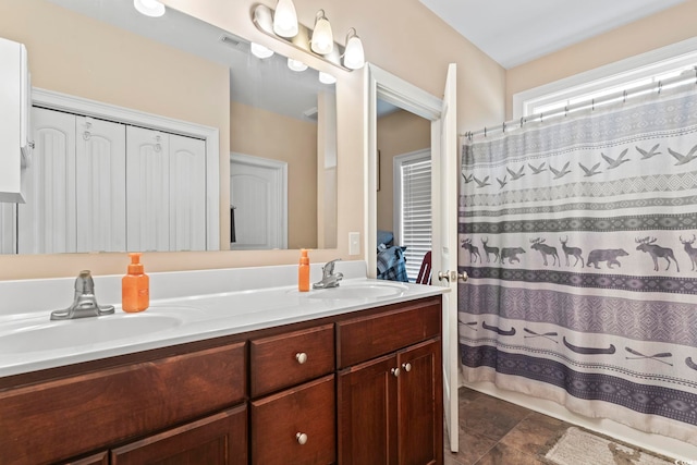 144 Baylee Cir, Aynor, SC 29544 - bathroom featuring double vanity, stone finish floors, and a shower with shower curtain