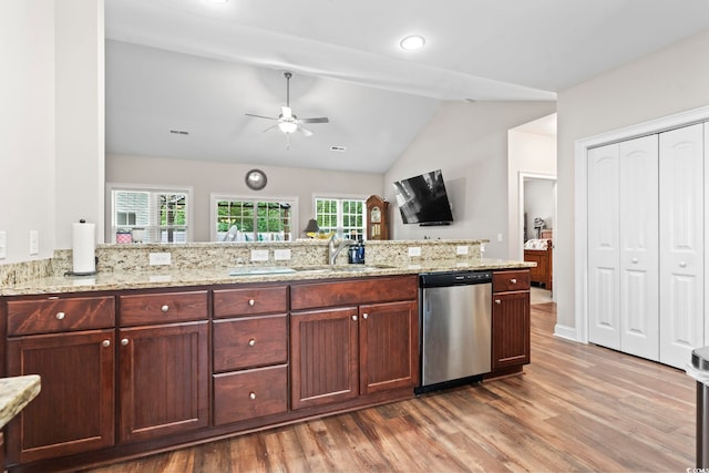 144 Baylee Cir, Aynor, SC 29544 - kitchen with dishwasher, wood finished floors, a ceiling fan, vaulted ceiling, and light stone counters