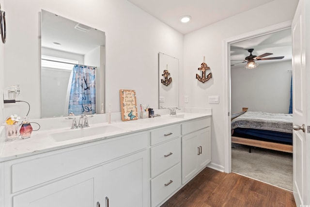 798 Woodland Farms Cir, Aynor, SC 29511 - full bath featuring double vanity, wood finished floors, ceiling fan, connected bathroom, and recessed lighting
